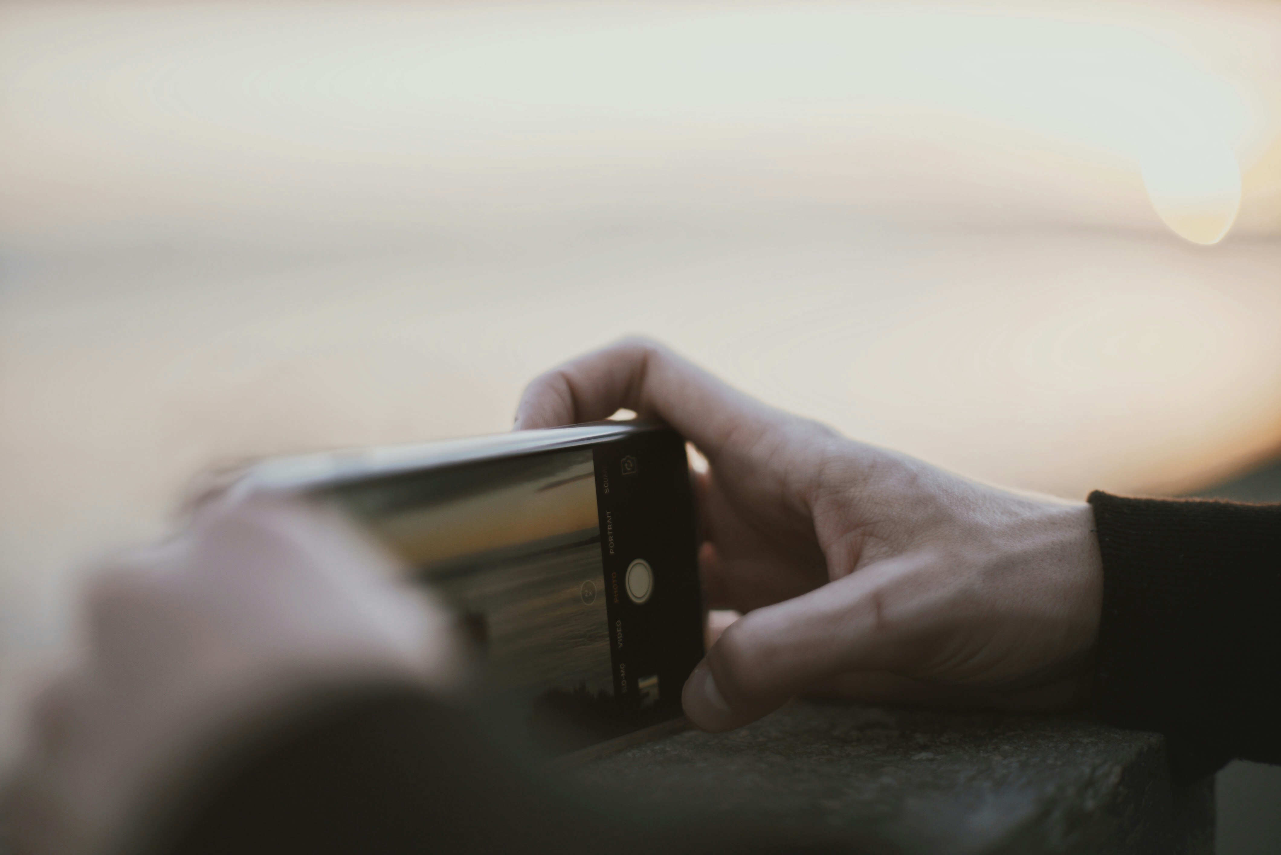 person taking a photo using smartphone